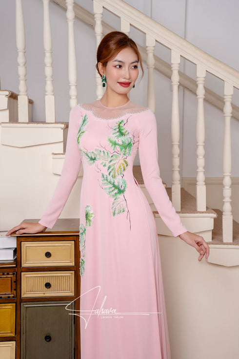 Elegant pink Ao dai features leaves beading