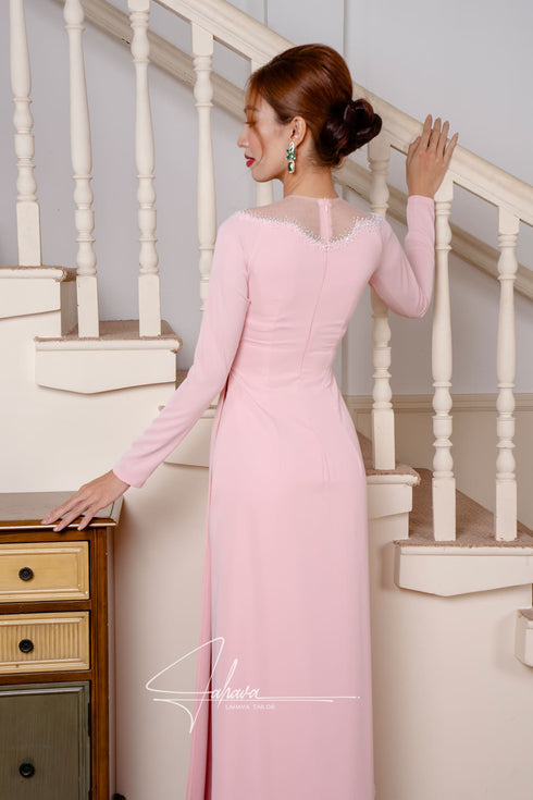 Elegant pink Ao dai features leaves beading