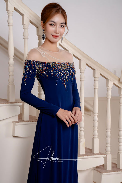 Dark blue ao dai features a luxurious beading design