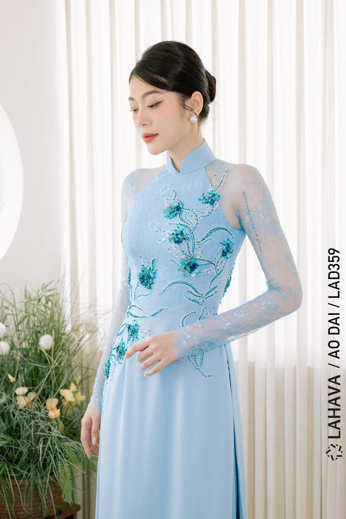 Sweet turquoise Ao dai features floral beadwork