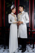 White wedding ao dai features intricate gold beadwork