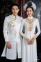 White couple ao dai with gold beadwork