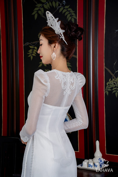Modern wedding ao dai features a timeless white color