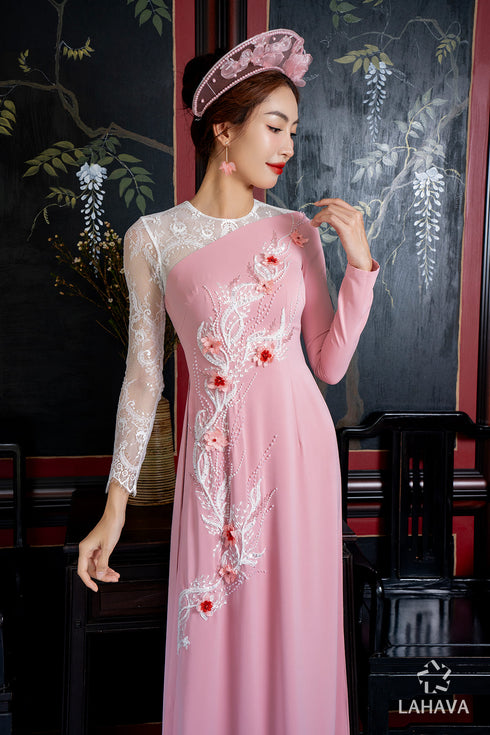 Pink bridal ao dai is adorned with 3d flowers