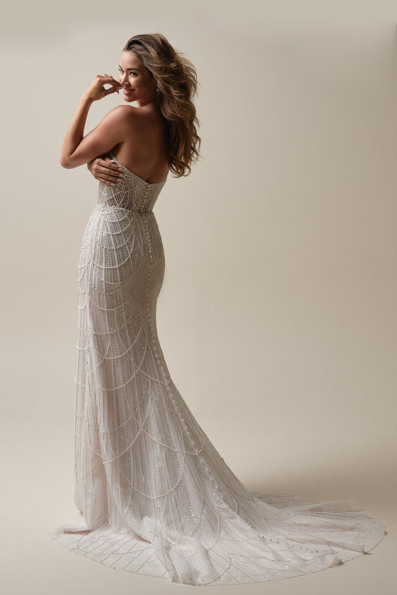 beaded gatsby wedding dress Gatsby-styled beadwork trickles across this fully beaded fit and flare wedding gown