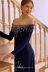 Dark blue ao dai features a luxurious beading design