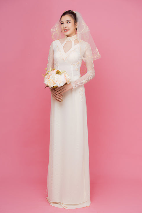 Beige cut out ao dai with embroidery lace