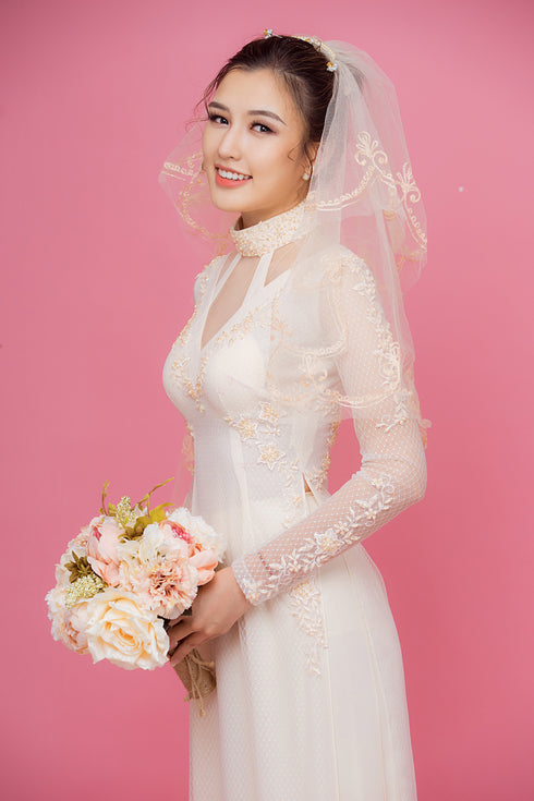 Beige cut out ao dai with embroidery lace