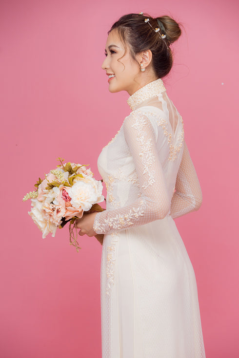 Beige cut out ao dai with embroidery lace