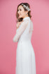 White modern ao dai with lace embellished