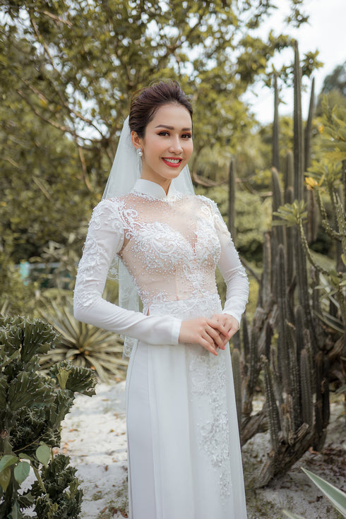 White modern ao dai with laces