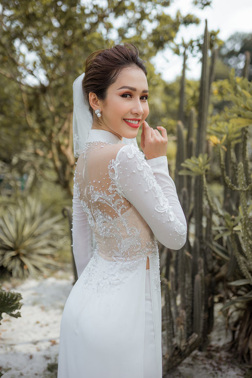 White modern ao dai with laces